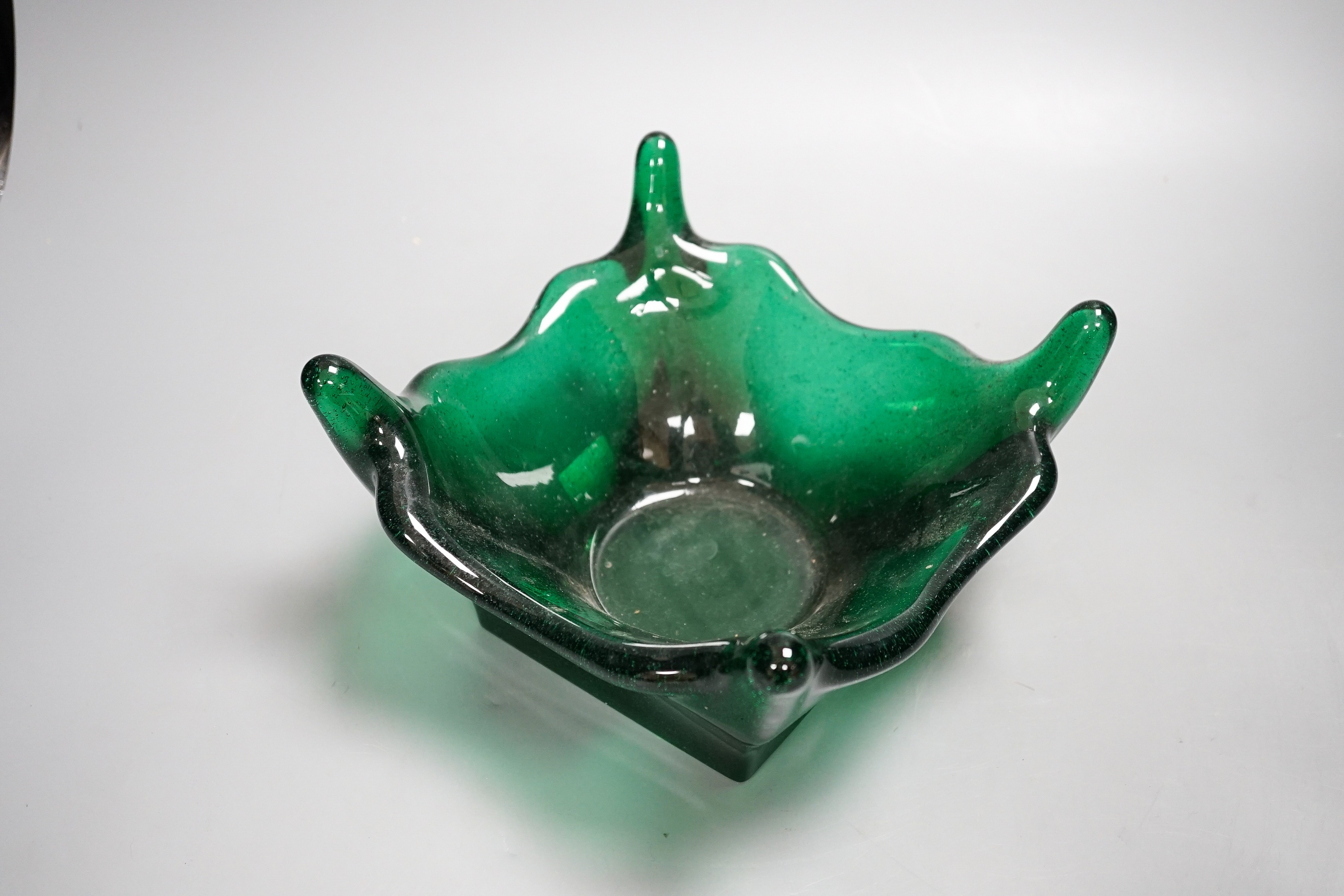 A large green studio glass bowl 27cm corner to corner